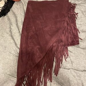 Suede and fringed high low skirt.